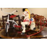 A mid-20th century child's painted pressed metal and tubular rocking horse; together with a