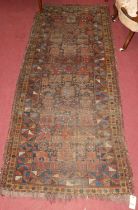 A Turkish woollen hall rug, geometric floral decorated within conforming tramline borders (worn