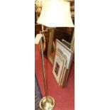 A contemporary brushed metal single branch arm floor light
