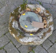 A reconstituted stone and brass mounted sundial