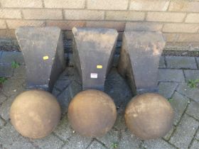 A set of three early 20th century terracotta gate post finials, each mounted with a plain sphere