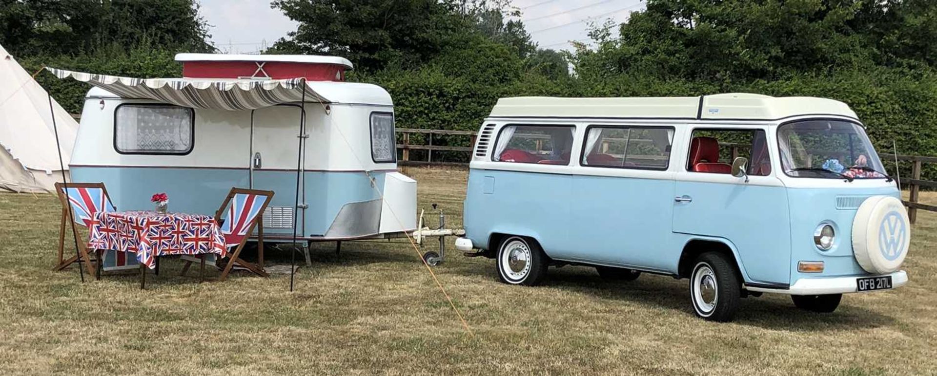 A 1972 VW Type 2 Westfalia Crossover camper van together with a 1971 Eriba Familia Caravan, both