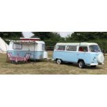 A 1972 VW Type 2 Westfalia Crossover camper van together with a 1971 Eriba Familia Caravan, both