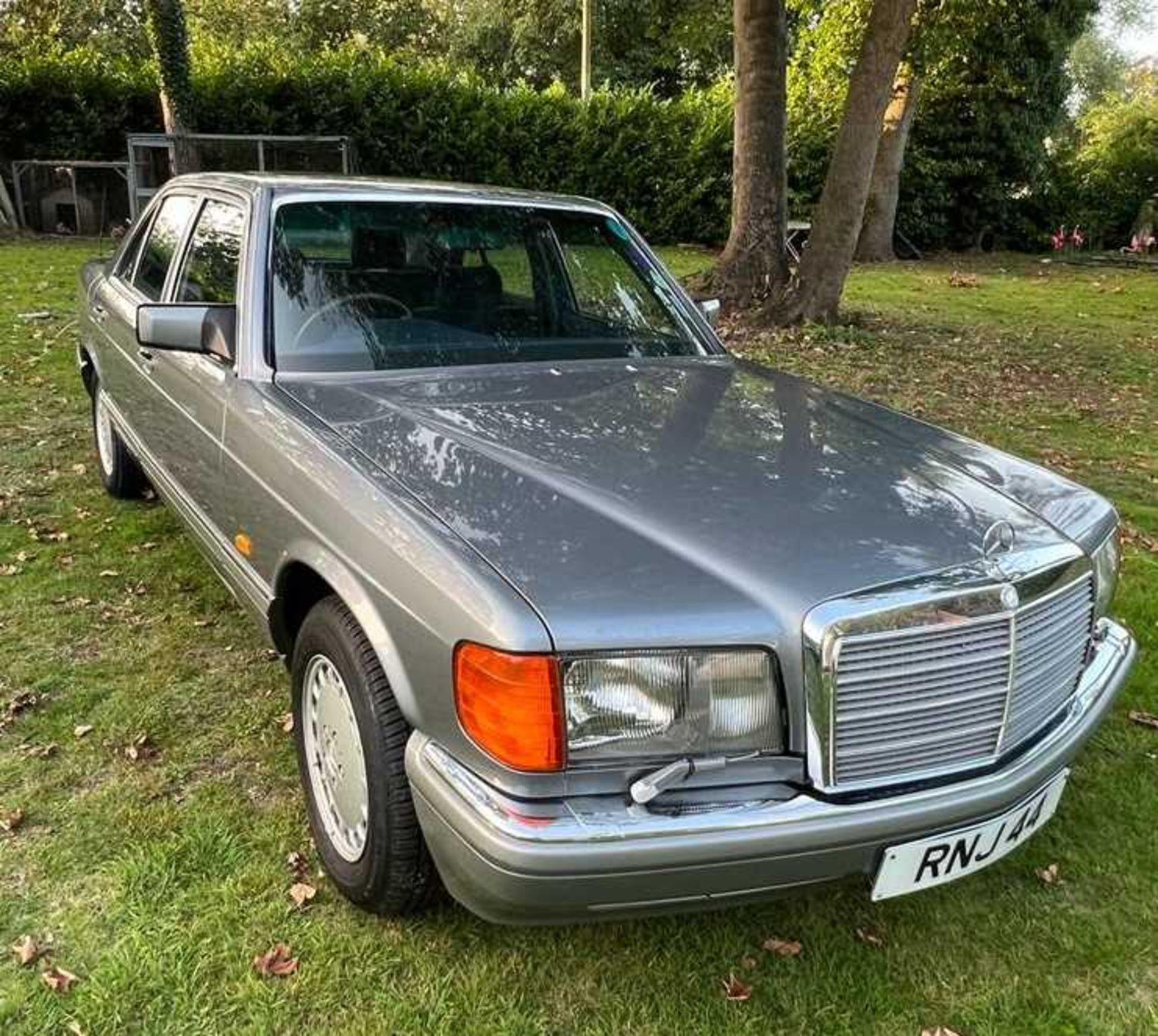 A 1988 Mercedes Benz 420SE in metallic grey Registration RNJ 44 (Note that this private registration