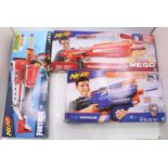 A collection of three various boxed Nerf guns to include Elite N Strike and Fortnite Nerf by Hasbro