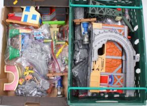 Two trays containing a collection of Thomas the Tank ER TL and Tomy action figures and playsets