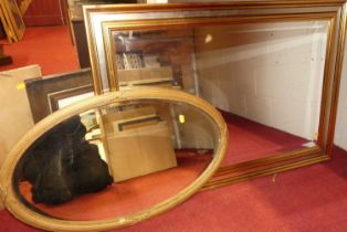 A reproduction gilt framed and bevelled rectangular wall mirror, 102 x 71cm; together with a gilt