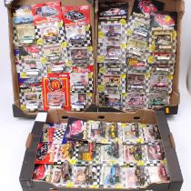 Three trays containing 45 various carded Matchbox and Racing Champions diecast Nascar vehicles to
