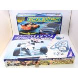 A collection of three various boxed Scalextric and Tyco gift sets to include a Scalextric Sport Le