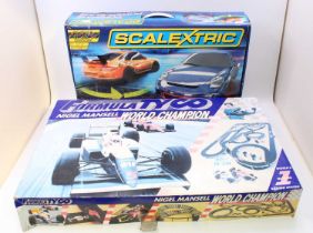 A collection of three various boxed Scalextric and Tyco gift sets to include a Scalextric Sport Le
