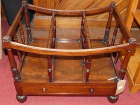 An early Victorian mahogany three division Canterbury, having single lower drawer, with turned