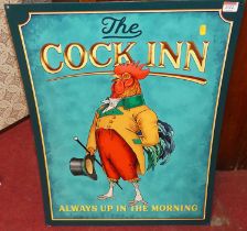 A printed tin advertising sign 'The Cock Inn', 70 x 50cm