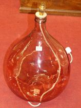 A coloured glass carboy converted into a lamp