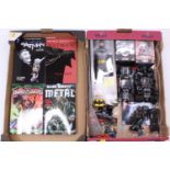 Two trays containing a quantity of Bat Man related collectables to include Lego, graphic novels, Hot