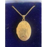 A 9ct gold and engraved picture locket on finelink neck chain, gross weight 5.4g