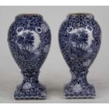 A pair of Villeroy & Boch blue & white transfer decorated vases of ovoid pedestal shape, height