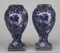 A pair of Villeroy & Boch blue & white transfer decorated vases of ovoid pedestal shape, height