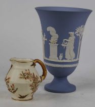 A Royal Worcester Old Ivory jug, shape No.1185; together with a Wedgwood jasperware vase, h.19cm