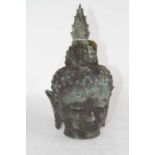 A verdigris metal Buddha's head, h.30cm