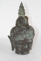 A verdigris metal Buddha's head, h.30cm