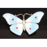 An early 20th century sterling silver and enamelled brooch in the form of a butterfly, numbered
