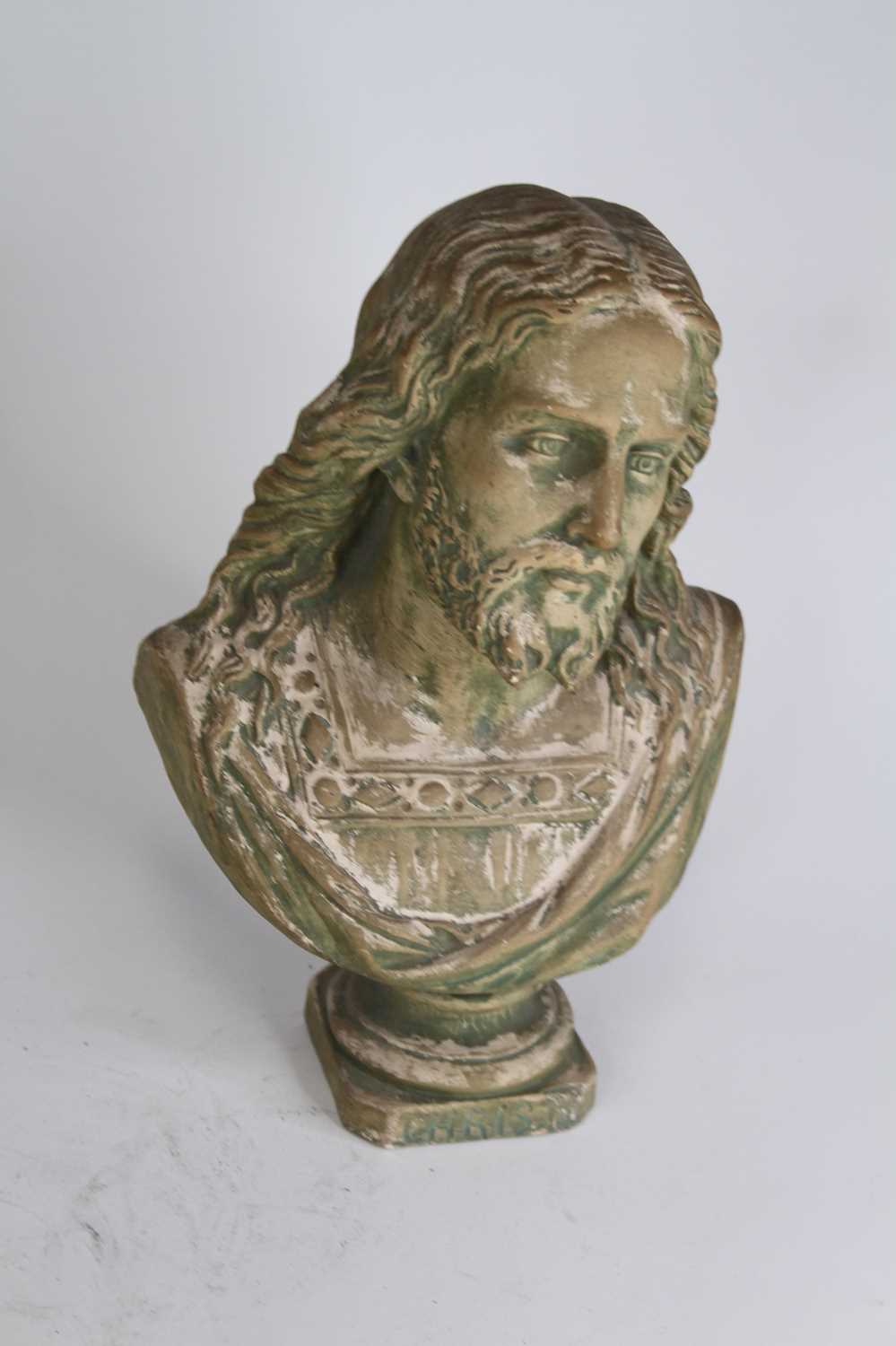 A painted pottery head and shoulders bust of Christ, h.32cm cracks to each side of the plinth - Image 2 of 3