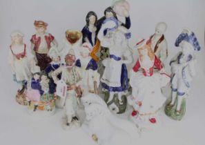 A collection of Victorian Staffordshire figures, to include spill-holders; together with continental