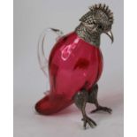 A Victorian style novelty metal mounted cranberry glass decanter in the form of a cockatoo, height