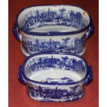 A graduated set of two blue and white transfer decorated foot baths, the largest w.45cm