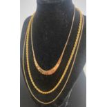 A modern 9ct gold ropetwist necklace; together with a 9ct three-colour gold graduated necklet; and a