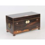A Regency rosewood and boxwood strung tea caddy, having inset ivory roundels and an ivory