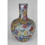 A Chinese porcelain vase, of bulbous form, enamel decorated with chrysanthemums, h.41cm