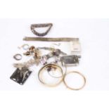A collection of miscellaneous costume jewellery to include gold plated hinged bangles, paste set