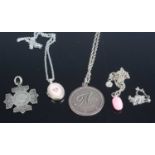 Two silver pendants, a silver locket, neck chains etc