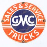 An enamel sign inscribed GMC Sales & Service Trucks, dia.30cm