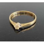 An 18ct gold diamond solitaire ring, the claw set round cut weighing approx 0.1 carats, 1.8g, size
