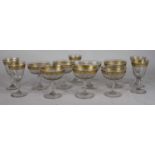 A collection of Venetian style drinking glasses, each having a gilt decorated rim