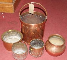 An early 20th century copper coal bucket, having studded bands and swing handle; together with