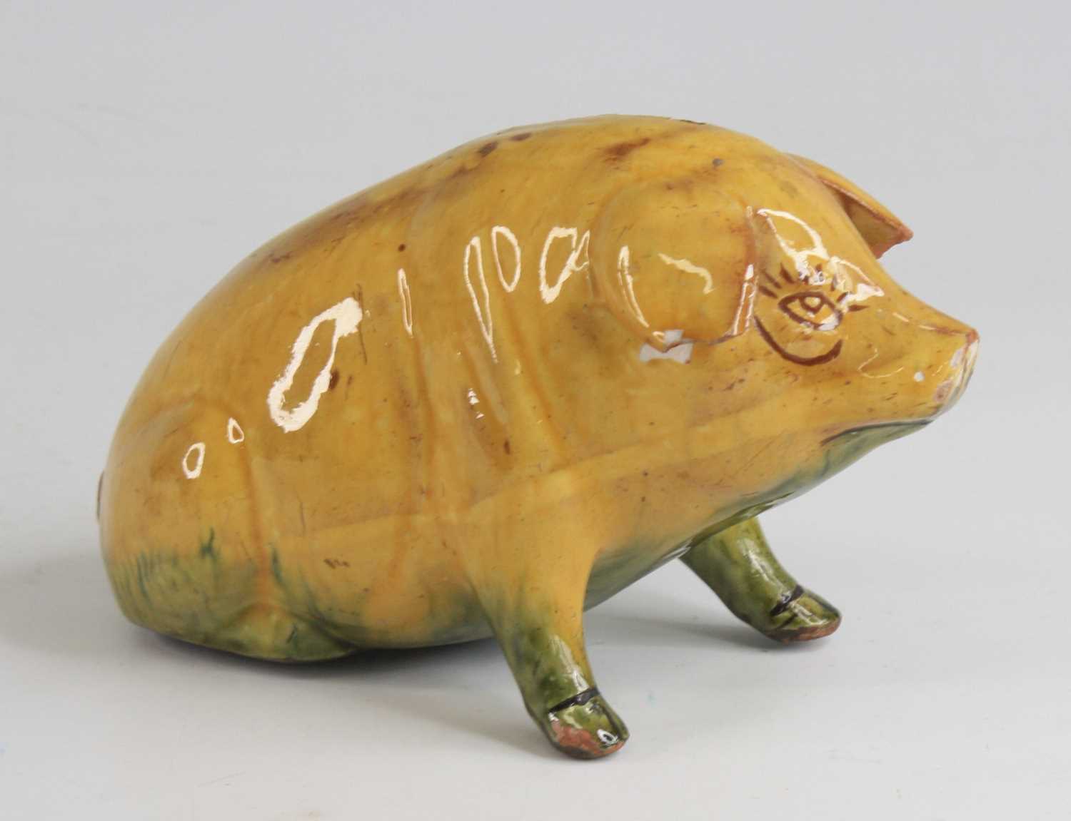 An Ewenny pottery piggy bank, shown in seated pose, having a mottled yellow and green glaze and - Image 2 of 5