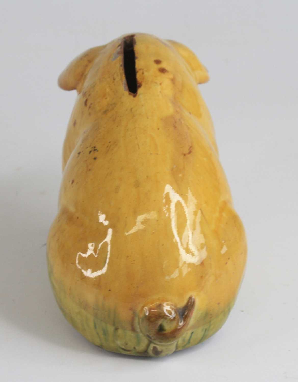 An Ewenny pottery piggy bank, shown in seated pose, having a mottled yellow and green glaze and - Image 5 of 5