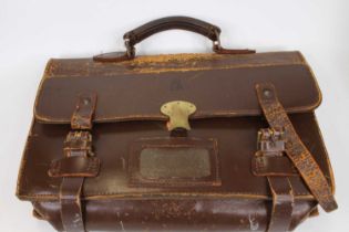 A brown leather satchel, with brass fittings and embossed crowned ERII cypher
