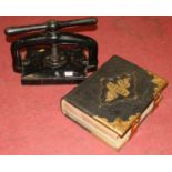 A Victorian family Bible, bound in gilt-tooled black leather with brass mounts; together with an