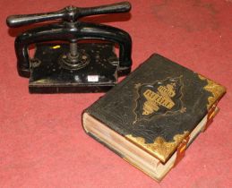 A Victorian family Bible, bound in gilt-tooled black leather with brass mounts; together with an