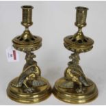 A pair of late 19th century Dutch brass table candlesticks, each having a removable sconce and on