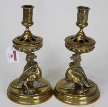 A pair of late 19th century Dutch brass table candlesticks, each having a removable sconce and on