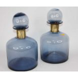 A pair of large blue glass bottles and stoppers, height 37cm condition good.