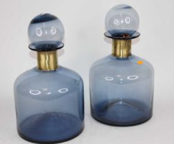 A pair of large blue glass bottles and stoppers, height 37cm condition good.