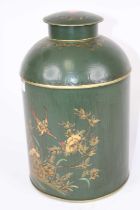 A green toleware type tea canister, gilt decorated with birds amongst flowers, h.36cm