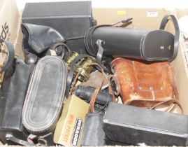 Two boxes of assorted optical equipment to include Sunagor mini pocket binoculars, brass opera