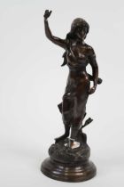 A bronze figure of a lady, shown with arm raised, h.47cm